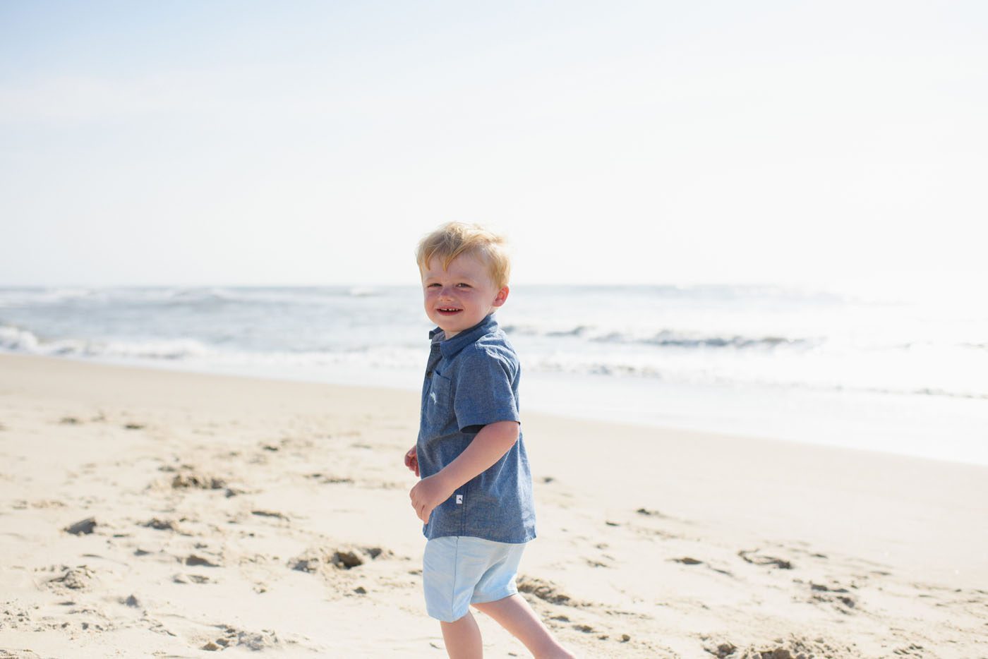 Kids playing on the beach at an Outer Banks portrait session