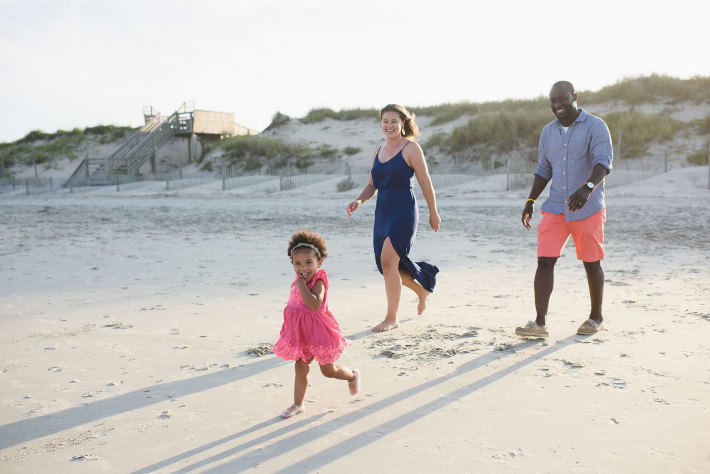 Family walking on the beach in Corolla during an Outer Banks portrait session