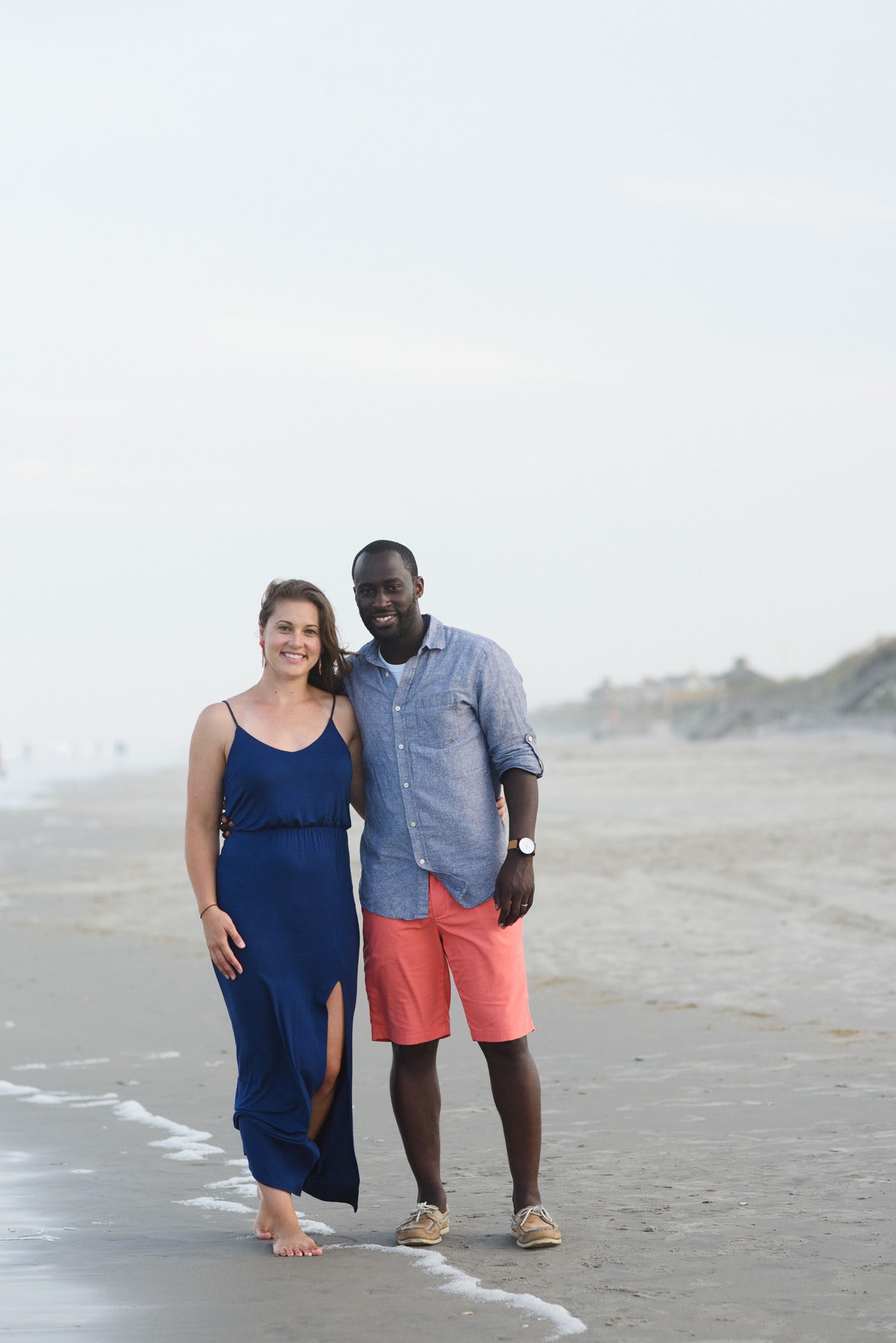 Couple enjoying a family portrait session in Corolla