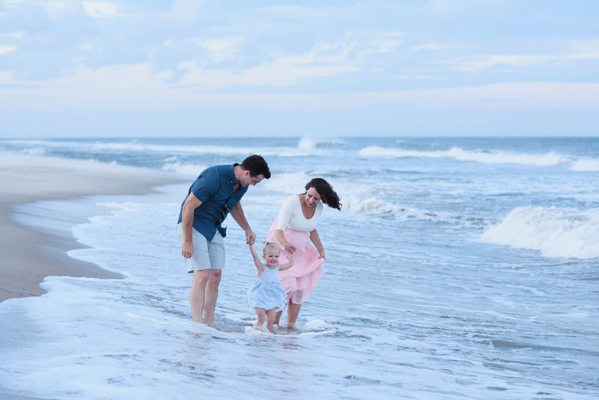 Playing in the waves at an Outer Banks family portraits session
