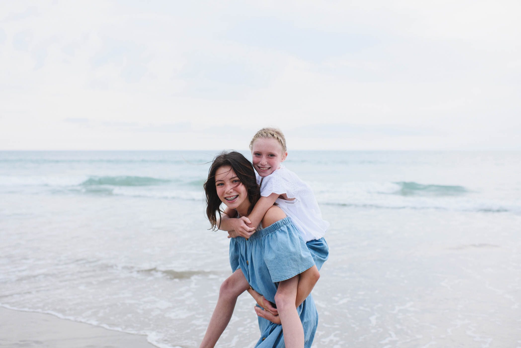 Sisters together on the beach in Corolla Outer Banks