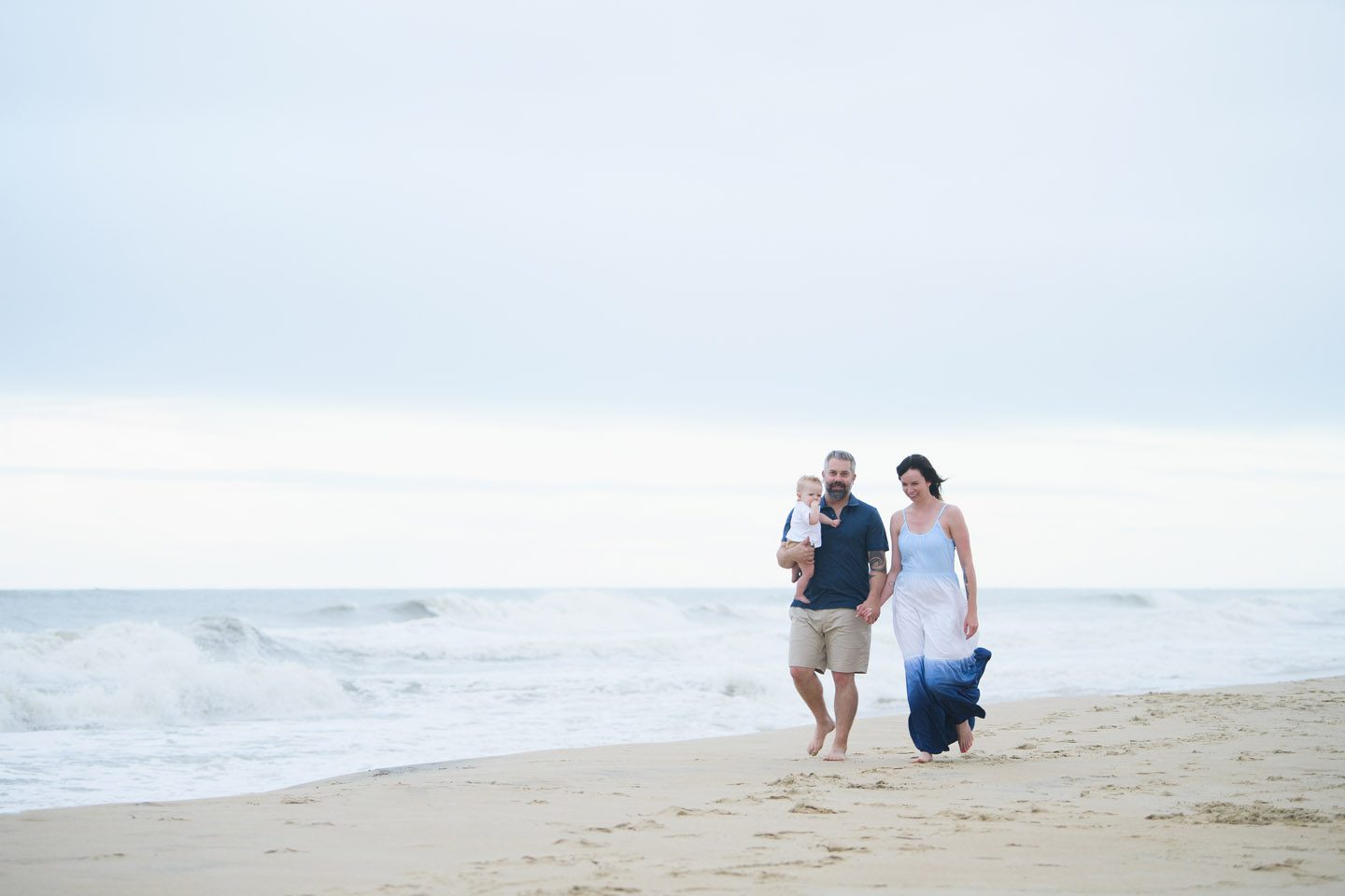 Family walking along the beach in Nags Head