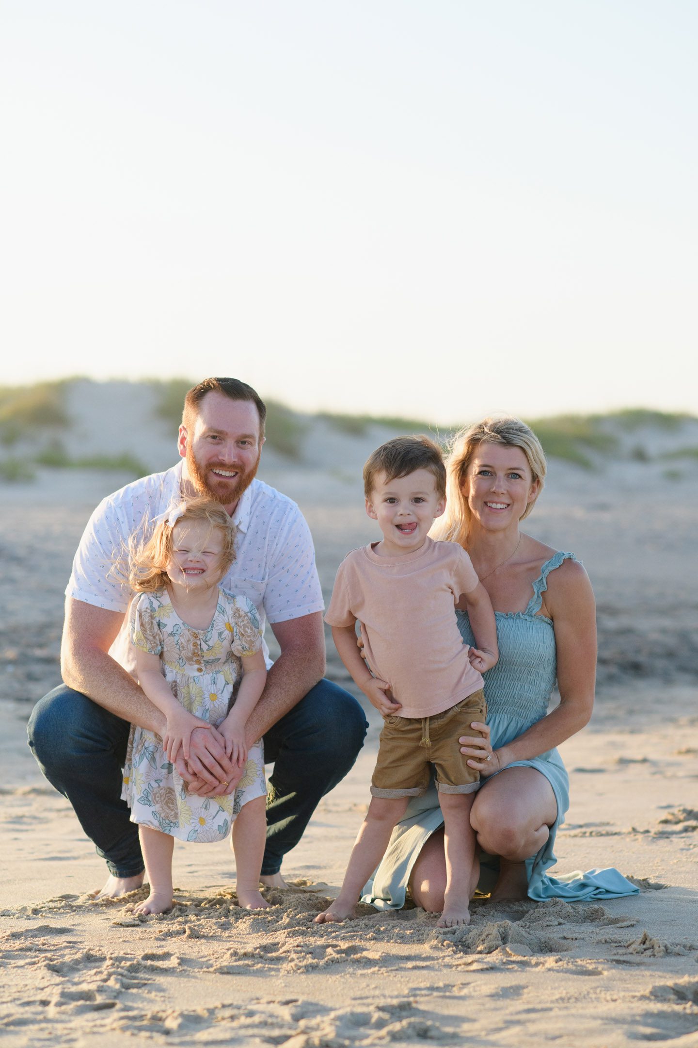 Family portraits on the beach with parents and children