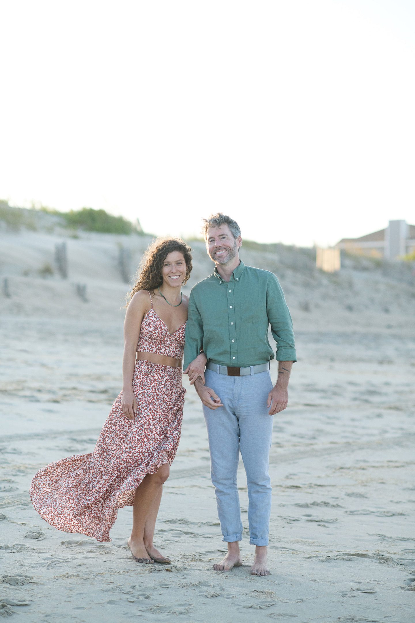 What to wear guide, a portrait of a couple wearing coastal colors and patterns on the Outer Banks