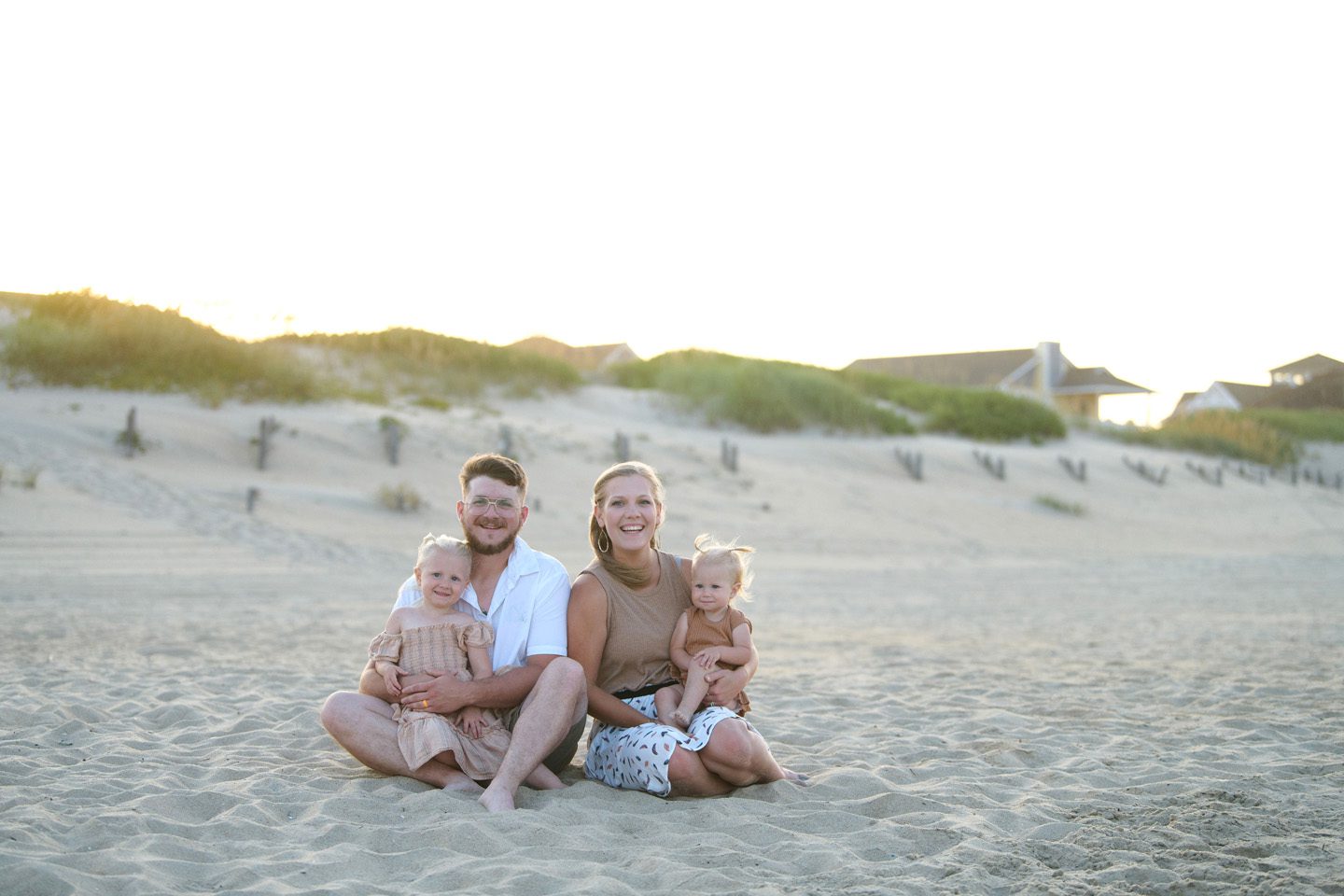 What to wear guide, a family wearing whites, creams, and tans for their Outer Banks portraits