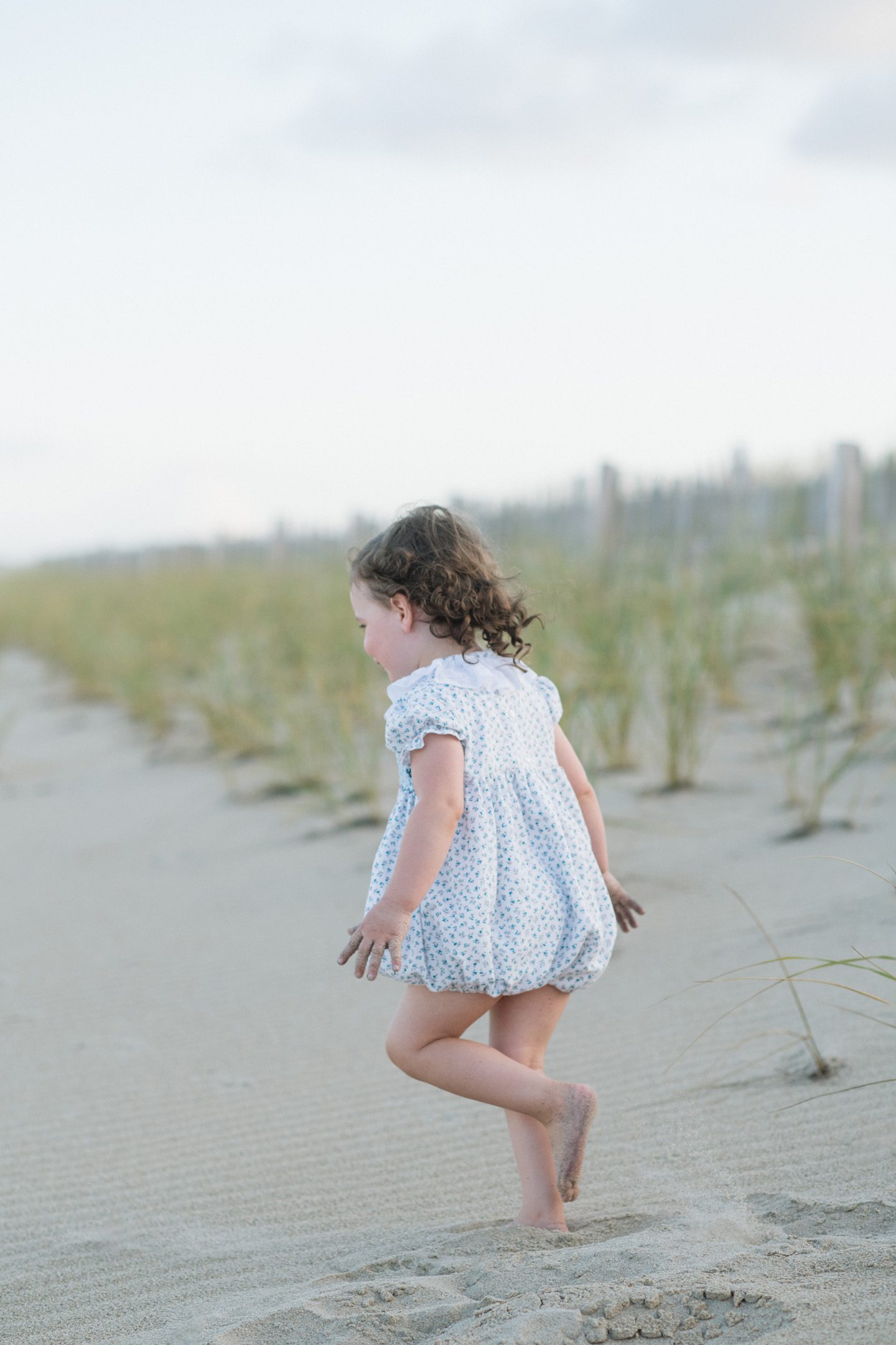 A child running on the beach in Nags Head